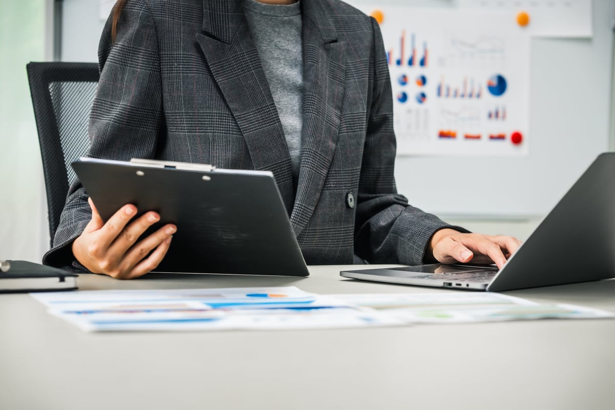 Advisor reviewing financial documents and investment data